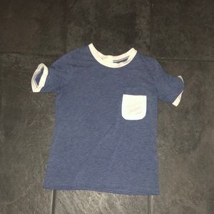 A blue shirt tee with white pocket